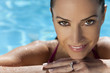 Face of a Beautiful Smiling Woman Relaxing In Swimming Pool