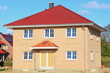 Neubau Einfamilienhaus Dachziegel Rohbau blauer Himmel