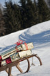 Sleigh with presents in snowy landscape