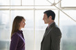 Photo: Business man and business woman facing each other Business man and business woman facing each other