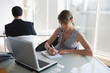 Photo: Business woman with headset taking notes Business woman with headset taking notes