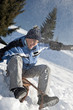 Young man sledding