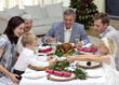 Children pulling a Christmas cracker at home