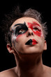 a man with colored painted face