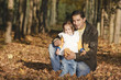 father with daughter in the autumn park father with daughter in the autumn park