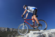 Photo: A man riding a mountain bike downhill style A man riding a mountain bike downhill style