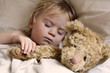 baby toddler asleep with teddy bear
