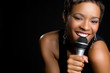Black Woman Singing into Microphone