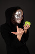 Two-faced sorceress with green apple tempt