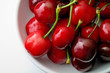 Fresh cherries with stalk in a bowl (from top)
