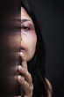 Injured woman hiding in dark