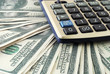 Photo: Heap of dollars and calculator Heap of dollars and calculator