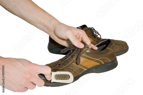 Photo: Man brush shoes Man brush shoes