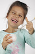 little successful girl eating yogurt