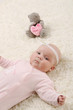 a young and beautiful baby in pink