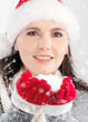 Winter girl blowing snowflakes
