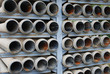 many stacked drain pipes on a construction site