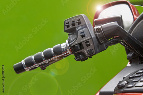 Photo: Motorbike handle bar with lens flare Motorbike handle bar with lens flare