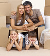 Family in new house playing with boxes