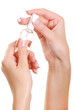 well-groomed female hand hold the bottle of a nail vanish well-groomed female hand hold the bottle of a nail vanish
