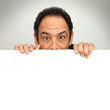 shocked behind billboard