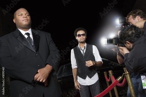 Photo: Male celebrity arriving at media event Male celebrity arriving at media event