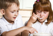 Brother and sister taste cream