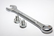 Chrome combination wrench and screws
