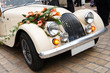 Vintage Wedding Car Decorated with Flowers Vintage Wedding Car Decorated with Flowers