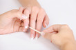 cleaning cuticle of fingers with cosmetic stick cleaning cuticle of fingers with cosmetic stick
