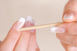 Female cleaning cuticle on hands Female cleaning cuticle on hands