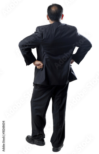 Photo: Balding man in Suit Arms Akimbo Balding man in Suit Arms Akimbo