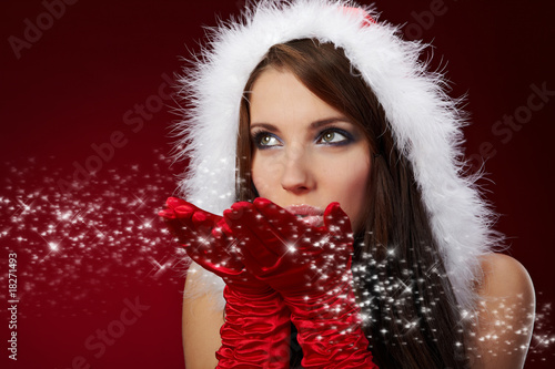 Photo: Portrait of beautiful sexy girl wearing santa claus clothes Portrait of beautiful sexy girl wearing santa claus clothes