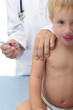 Vaccination: doctor injecting baby