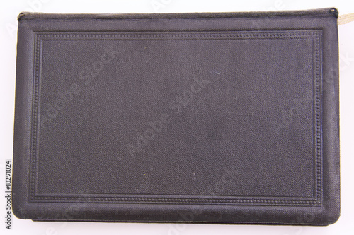 Photo: Black religious hymnbook with old black leather cover. Black religious hymnbook with old black leather cover.