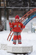 little girl in red overalls jumps