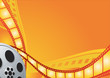 Film reel on the orange background Film reel on the orange background