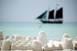 Black pirate tallship against sand fortress
