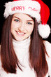 Pretty woman wearing santa hat