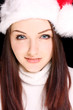 Pretty woman wearing santa hat