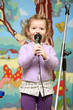 Little girl singing with smile