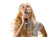 beautiful blond young woman singing into a microphone
