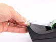 Tape dispenser - With a hand pulling tape Tape dispenser - With a hand pulling tape