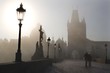 Charles bridge in Prague - morning in fog Charles bridge in Prague - morning in fog