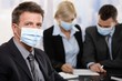 Business people fearing h1n1 virus