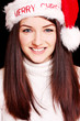 Pretty woman wearing santa hat