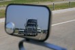Truck coming rear view from the road miror