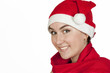 The beautiful girl smiles in a New Year's cap The beautiful girl smiles in a New Year's cap