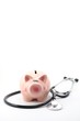 stethoscope and piggy bank