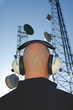 Foto: Bald man with headphones and antenna Bald man with headphones and antenna